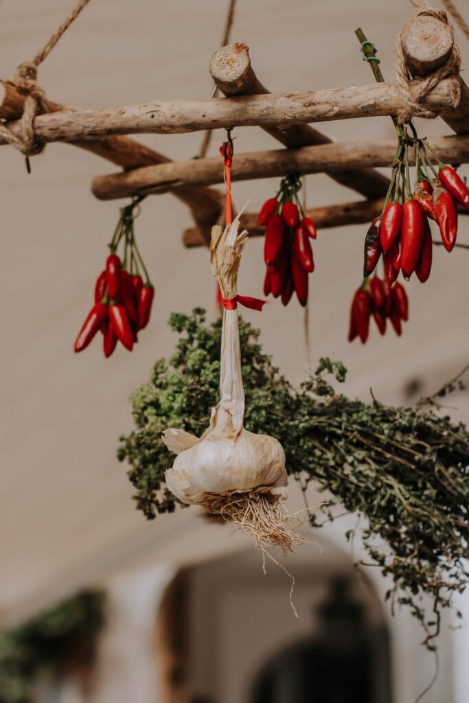 Preserving food without canning by air-drying herbs, garlic, and peppers